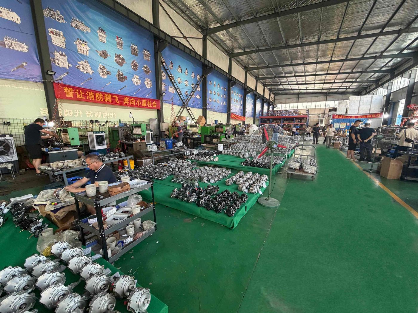 Assembly hall with rows of finished fuel injection pumps